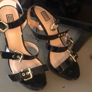 Black strappy heels, barely worn but with a couple knicks on the back heel